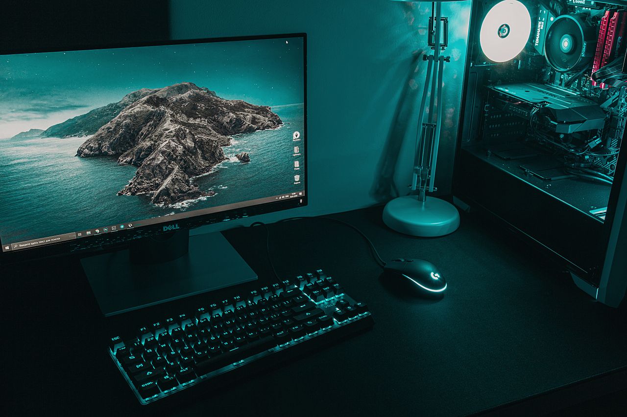 Mastering the First Impression: Your intriguing post title goes here High angle of computer monitor with keyboard and mouse placed on table near CPU in dark workplace